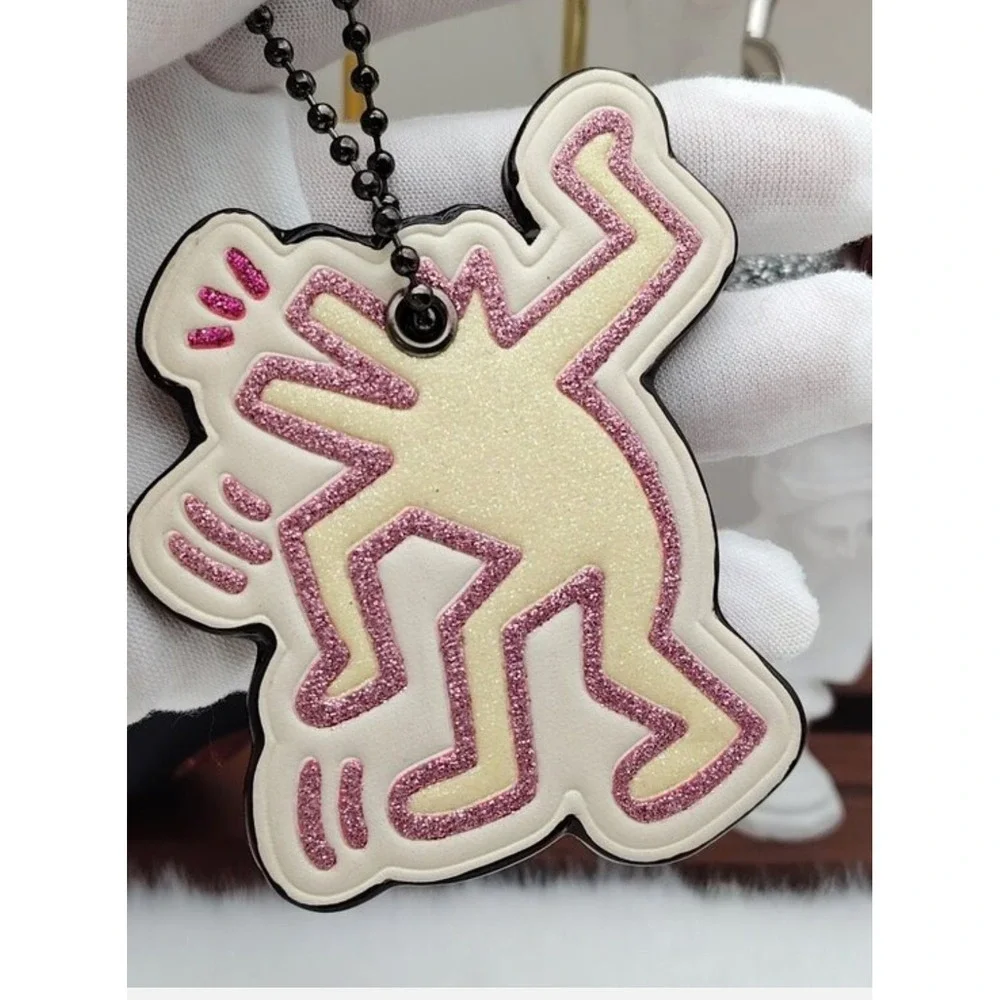 Coach x Keith Haring Dancing Man Glitter Leather Bag Charm Keychain Pink Brown